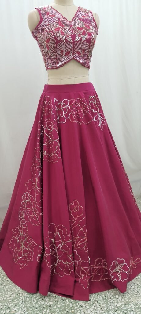 Magenta bespoke lehenga with a hand embroidered hem and matching blouse